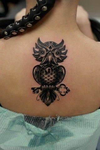 Tattoo of a black owl