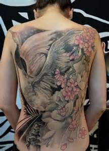 Awesome heron tattoo with flower