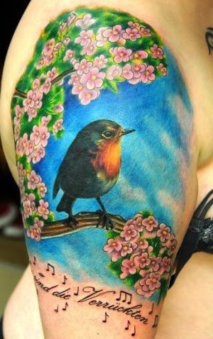Bird and cherry blossom tattoo