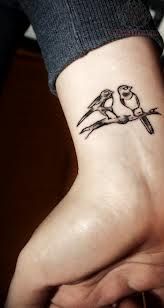 Birds couple tattoo on wrist