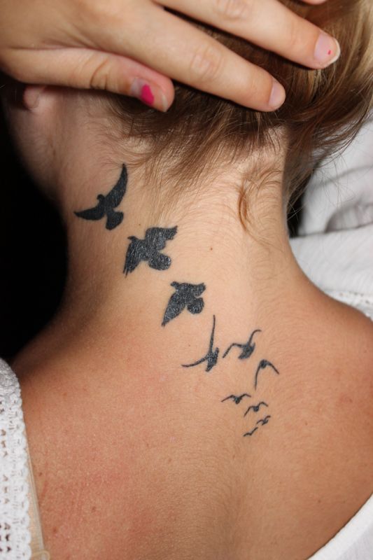 Birds tattoo on neck