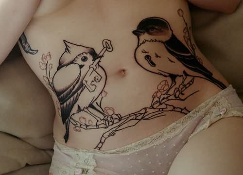 Birds tattoo on belly