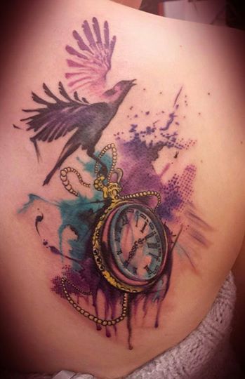 Black bird with clock tattoo