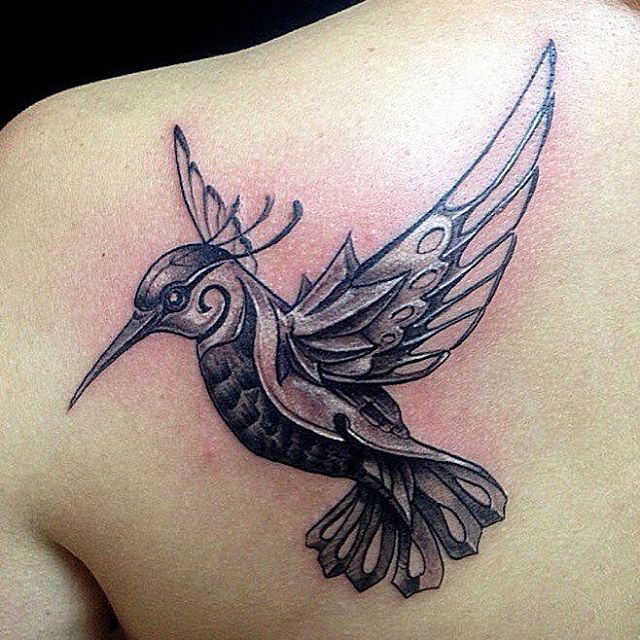 Metal bird tattoo