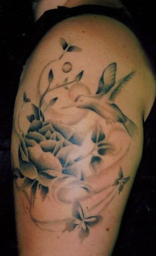 Hummingbird and flowers tattoo