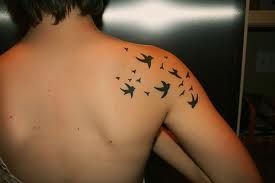Many small birds as tattoo