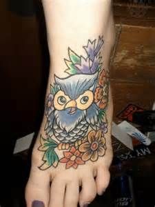Navy blue owl as foot tattoo
