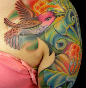 Nice bird and flowers tattoo