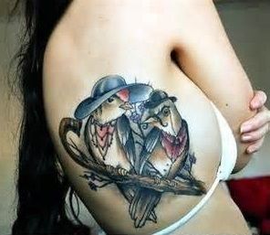 A pair of birds tattoo