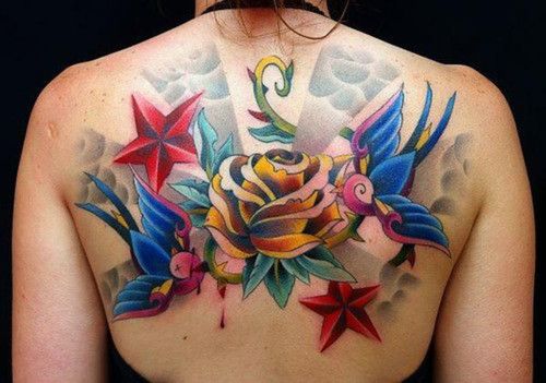 Pink and blue swallows back tattoo