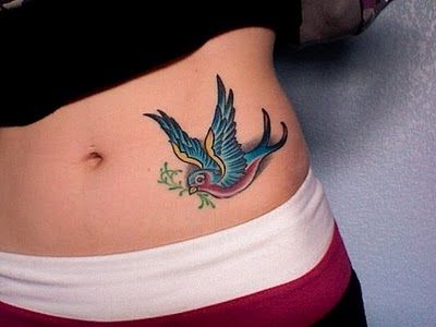 Red and blue swallow tattoo