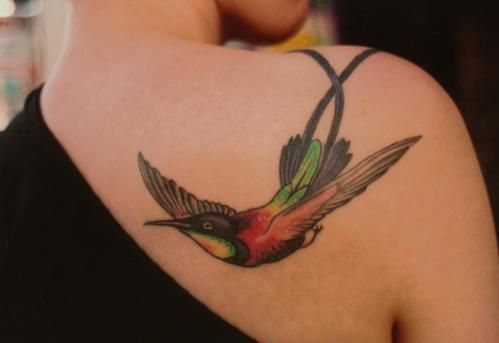 Red and green hummingbird tattoo