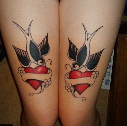 Swallows and hearts tattoo