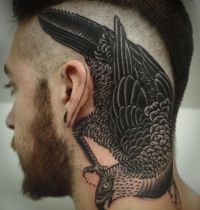 Awesome black bird tattoo
