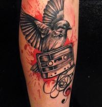 Bird and cassette tape tattoo
