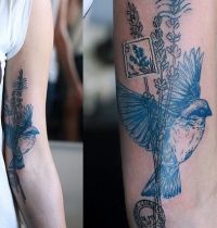 Bird and postage stamp tattoo