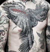 Bird and spider tattoo