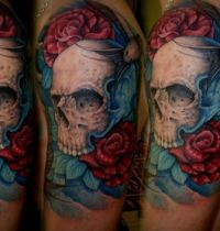 Tattoo with birds, skull and flowers