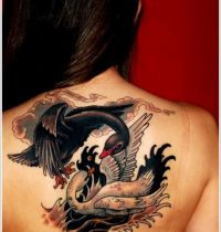 Black and white swan tattoo