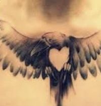 Black bird with heart tattoo
