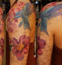 Bluebirds among flowers tattoo