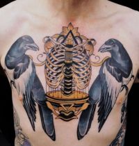 Chest tattoo with two magpies