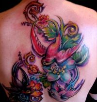 Colourful birds and flowers tattoo