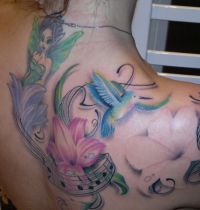 Colourful hummingbird tattoo