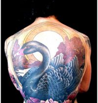 Dark swan among lotus tattoo