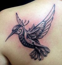 Metal bird tattoo
