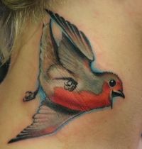 Grey and red bird tattoo