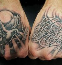 Hands tattoo with dove and words