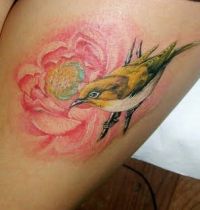 Pink lotus and bird tattoo