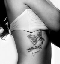 Bird and word tattoo