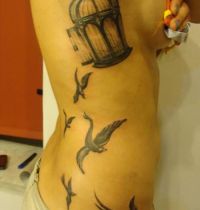 Birdcage and birds tattoo