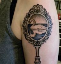 Mirror with swan tattoo