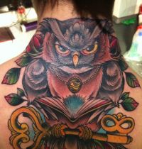 Neck tattoo with owl and key