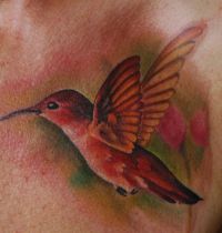 Orange hummingbird tattoo