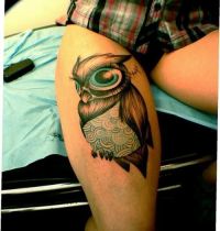 Owl with big eyes tattoo