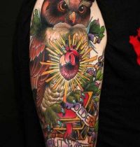 Owl with books tattoo