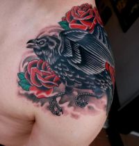 Red roses and bird tattoo