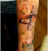 Sparrow among flowers tattoo