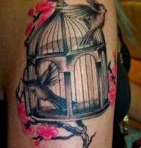 The birdcage with birds tattoo
