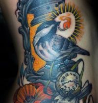 Two birds and lamp tattoo