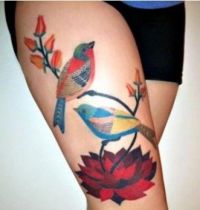 Two birds with flowers tattoo