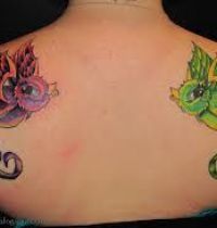 Two cartoon birds tattoo