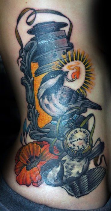Two birds and lamp tattoo