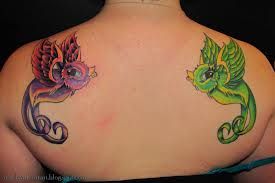 Two cartoon birds tattoo
