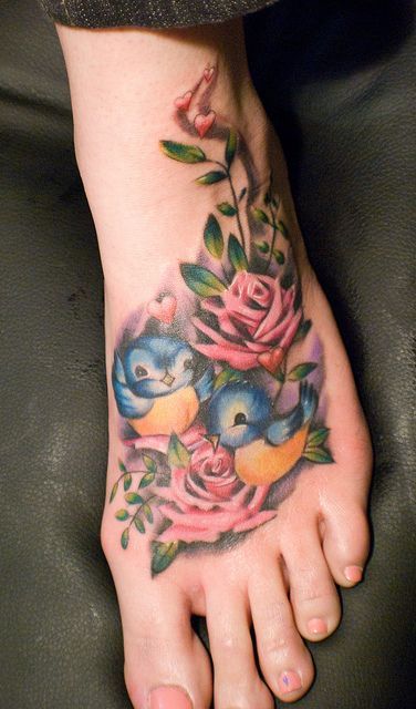 Two small birds and roses tattoo