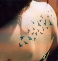 Small birds back tattoo